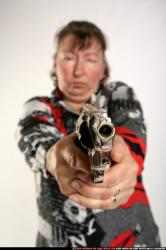Woman Old Average White Fighting with gun Standing poses Casual