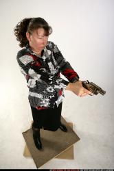 Woman Old Average White Fighting with gun Standing poses Casual