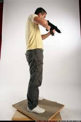 Man Adult Athletic White Fighting with submachine gun Standing poses Sportswear