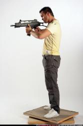 Man Adult Athletic White Fighting with submachine gun Standing poses Sportswear