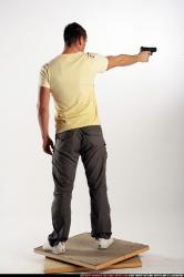 Man Adult Athletic White Fighting with gun Standing poses Sportswear