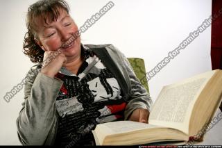 Paula-sitting-reading-happy