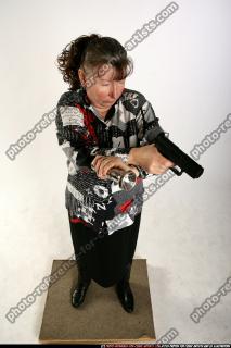 oldwoman-aiming-pistol-light
