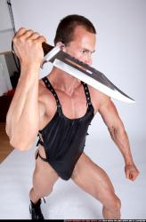 Man Adult Muscular White Fighting with knife Sitting poses Casual