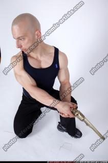 2009 08 RAFAEL KNEELING PISTOL POSES 04.jpg