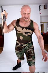 Man Adult Muscular White Fighting with knife Sitting poses Army