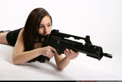 Woman Young Athletic White Fighting with submachine gun Laying poses Sportswear