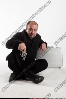 gangster-gurading-suitcase
