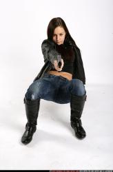 Woman Young Athletic White Fighting with gun Crouching Sportswear
