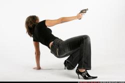 Woman Adult Athletic White Fighting with gun Crouching Casual