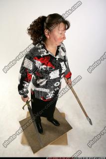 oldwoman-standing-sword-spear