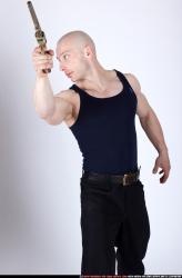 Man Adult Muscular White Fighting with gun Standing poses Sportswear