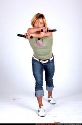 Woman Adult Muscular White Fighting with gun Standing poses Sportswear