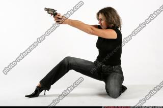 2009 10 WOMAN KNEELING SHOOTING REVOLVER 00.jpg