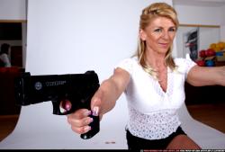 Woman Adult Muscular White Fighting with gun Kneeling poses Casual