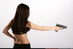 Woman Young Athletic White Fighting with gun Standing poses Sportswear