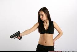 Woman Young Athletic White Fighting with gun Standing poses Sportswear