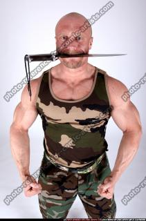 2009 12 ARMYMAN KNIFE IN MOUTH 03.jpg