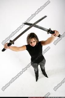 2009 12 WOMAN STANDING SWORDS CROSSING 02.jpg