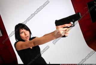 silvia-standing-aiming-pistol