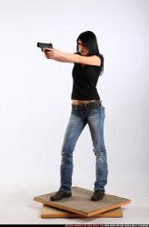 Woman Adult Athletic White Fighting with gun Standing poses Sportswear