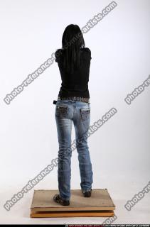 silvia-standing-aiming-pistol