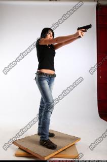 silvia-standing-aiming-pistol