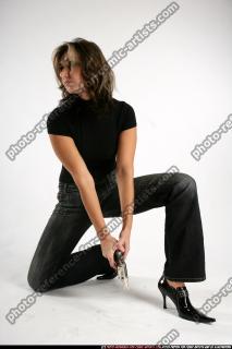 woman-kneeling-revolver