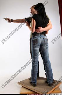 AIDEEN-STANDING-AIMING-GUNS