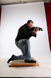 Man Adult Chubby White Fighting with submachine gun Kneeling poses Casual