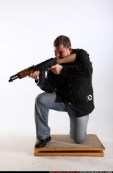 Man Adult Chubby White Fighting with submachine gun Kneeling poses Casual