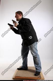 2010 03 DANIEL STANDING DUAL PISTOLS POSE1 02 C