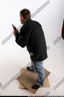 2010 03 DANIEL STANDING DUAL PISTOLS POSE1 03 A