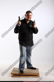 2010 03 DANIEL STANDING DUAL PISTOLS POSE1 00 B