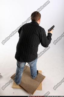 2010 03 DANIEL STANDING DUAL PISTOLS POSE1 05 A