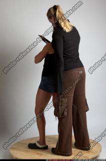 2010 07 WOMEN KNIFE UNDER NECK 03.jpg