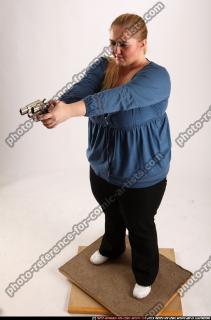 2010 07 BRITNEY STANDING AIMING PISTOL 01 A