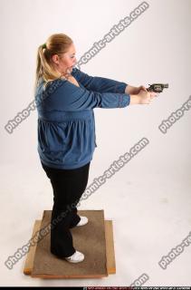 2010 07 BRITNEY STANDING AIMING PISTOL 06 A