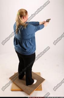 2010 07 BRITNEY STANDING AIMING PISTOL 05 A