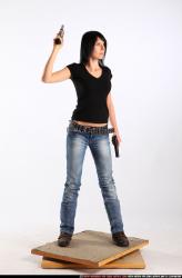 Woman Adult Athletic White Fighting with gun Standing poses Sportswear