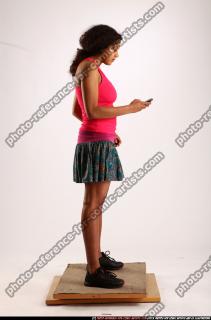 ella-standing-using-cellphone