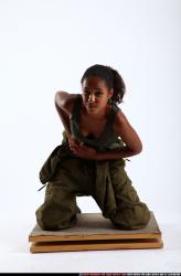 Woman Young Athletic Black Neutral Kneeling poses Army