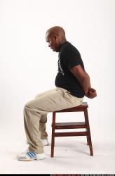 Man Old Average Black Neutral Sitting poses Casual