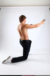 Man Young Athletic White Fighting with gun Kneeling poses Pants