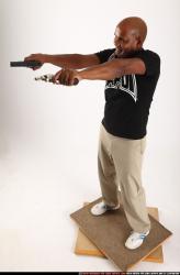 Man Old Average Black Fighting with gun Standing poses Casual