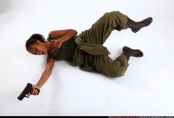 Woman Young Athletic Black Fighting with gun Laying poses Army