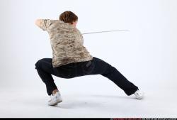 Man Young Athletic White Fighting with sword Kneeling poses Sportswear