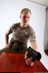 Man Adult Average White Fighting with gun Sitting poses Army