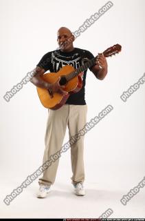 Gael Casaus-standing-playing-guitar