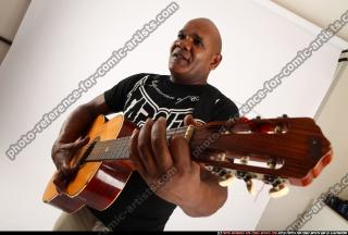 Gael Casaus-standing-playing-guitar